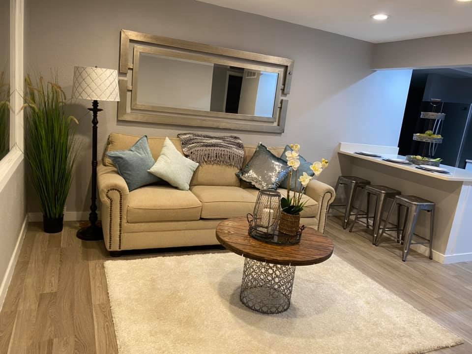 Warm, freshly cleaned living room with hardwood floors